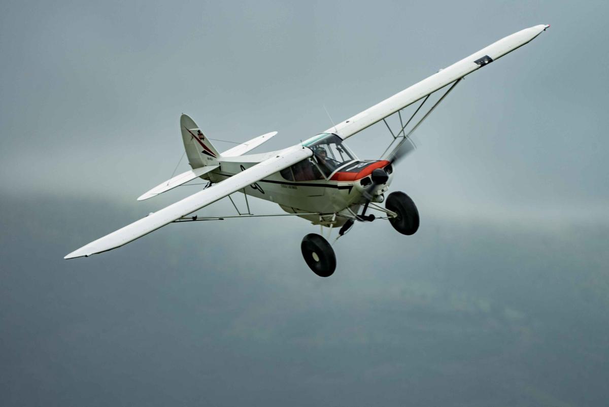 Tailwheel aircraft flying in the sky. Tailwheel Adventures in the sky.